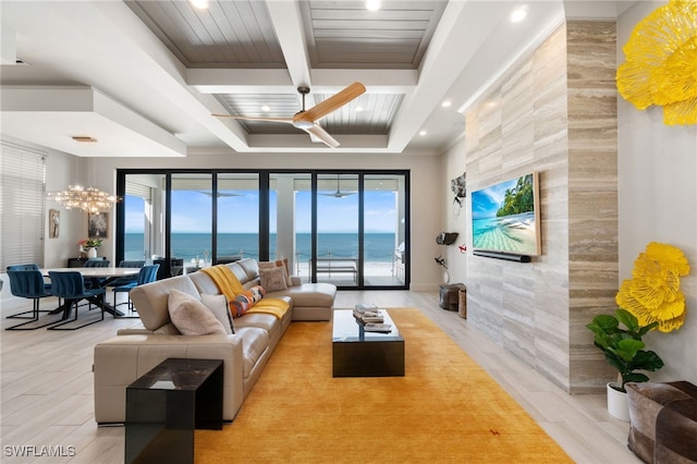 living area featuring beamed ceiling, recessed lighting, wood finished floors, a notable chandelier, and coffered ceiling