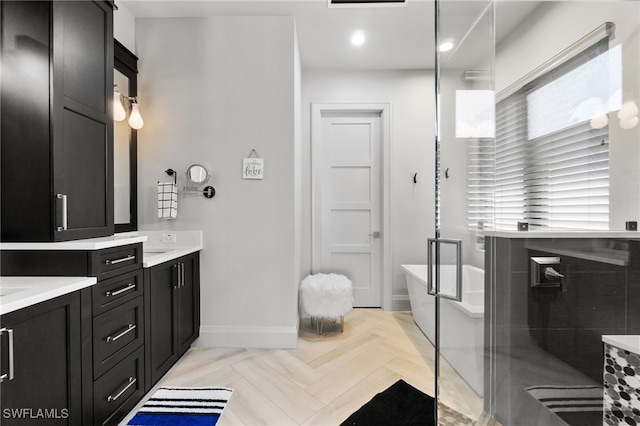 bathroom with vanity, separate shower and tub, and parquet flooring