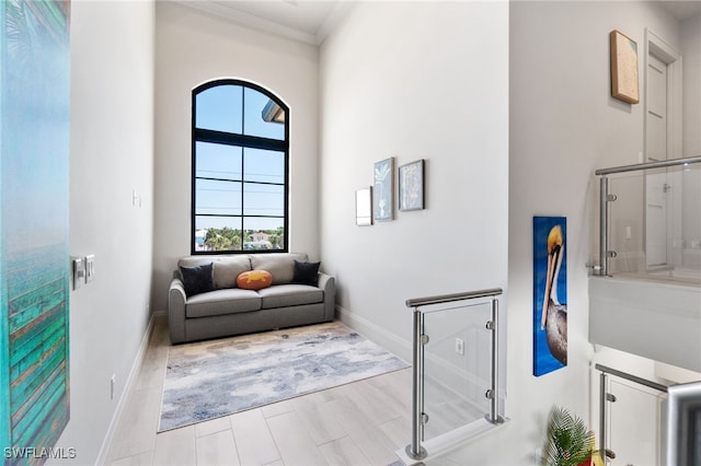 living area featuring baseboards