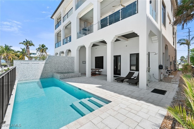 view of swimming pool with a patio