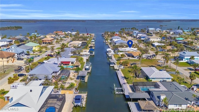 bird's eye view featuring a residential view and a water view