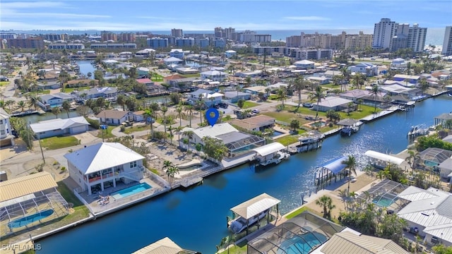 drone / aerial view with a water view and a city view