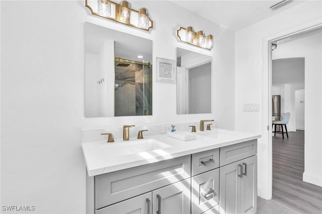 bathroom featuring vanity and wood-type flooring