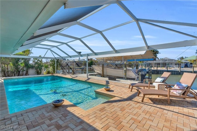 view of pool featuring a lanai and a patio