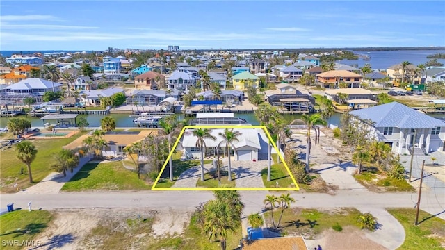 bird's eye view with a residential view and a water view