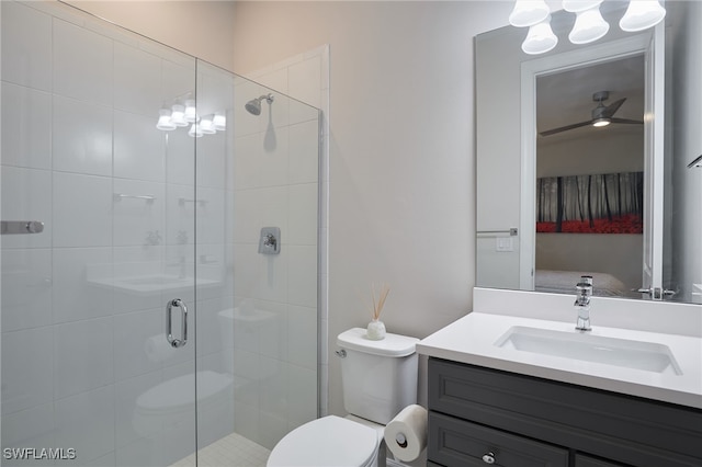 bathroom featuring an enclosed shower, vanity, and toilet