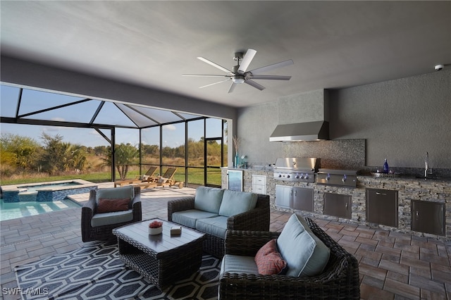 view of patio featuring an in ground hot tub, area for grilling, grilling area, and a lanai