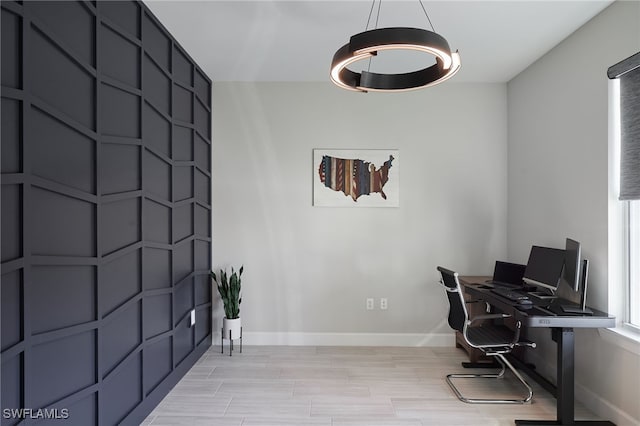 office area with light hardwood / wood-style flooring