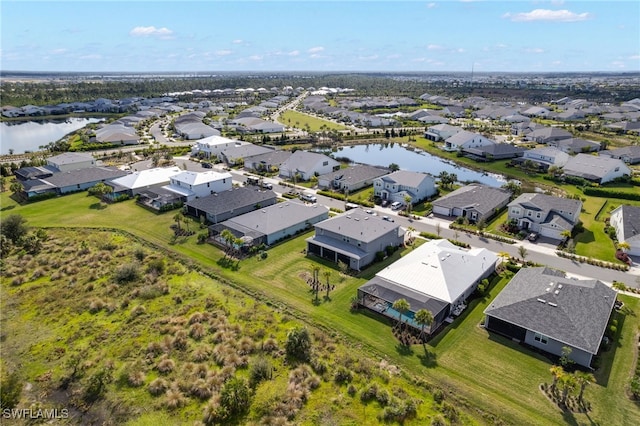 bird's eye view with a water view