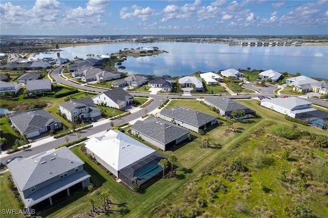 birds eye view of property featuring a water view