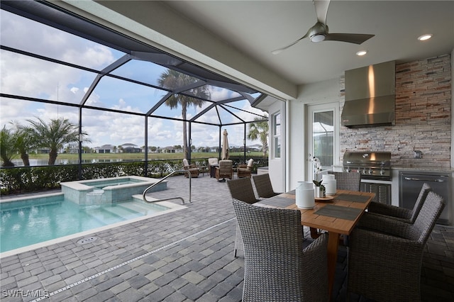 view of pool with a water view, area for grilling, an in ground hot tub, exterior kitchen, and a patio