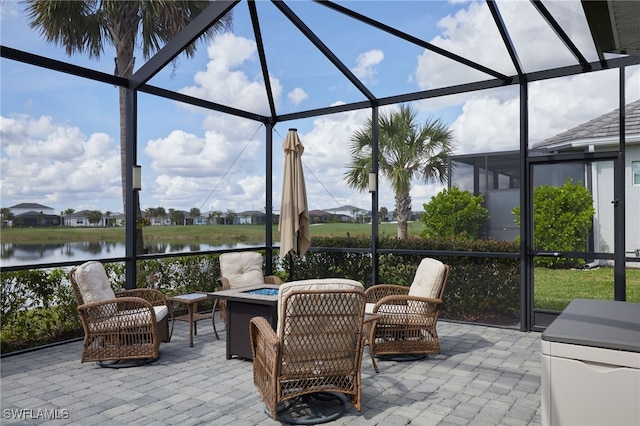 sunroom / solarium with a water view