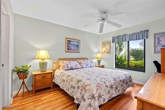 bedroom featuring ceiling fan and light hardwood / wood-style flooring