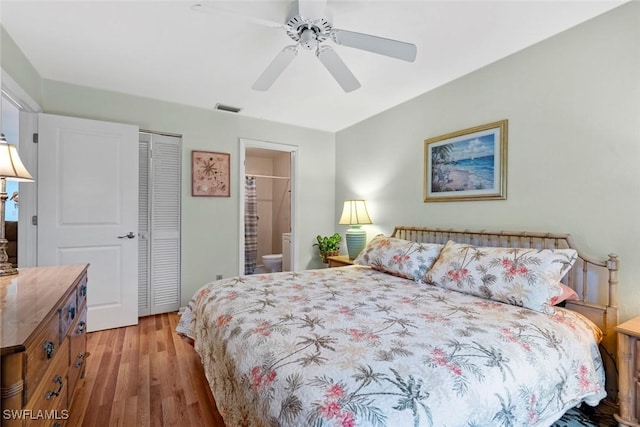 bedroom with ceiling fan, a closet, connected bathroom, and light hardwood / wood-style flooring