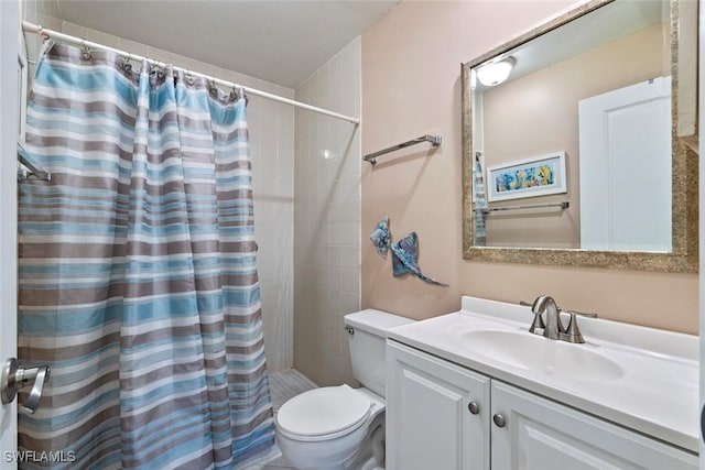 bathroom featuring vanity, toilet, and a shower with shower curtain