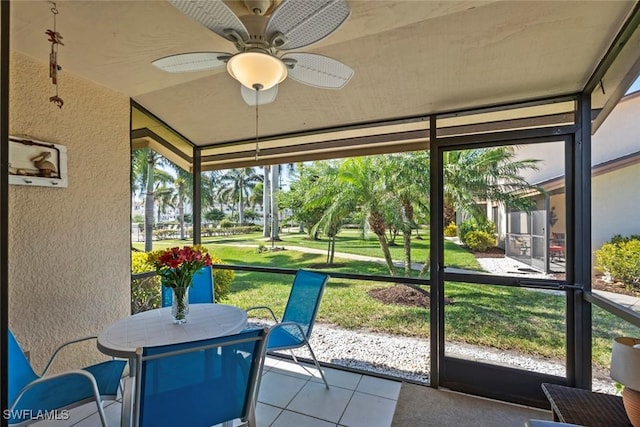 sunroom featuring ceiling fan