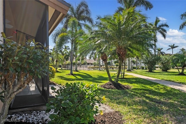 view of home's community featuring a lawn