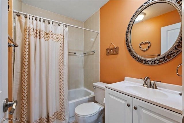 full bathroom featuring vanity, shower / bath combo, and toilet