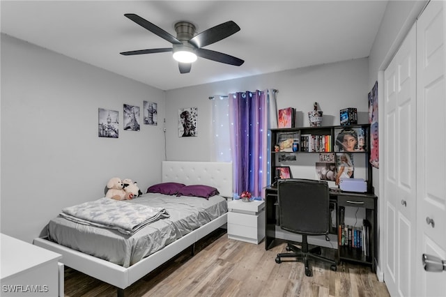 bedroom with wood-type flooring and ceiling fan