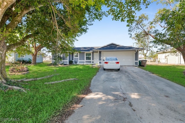 single story home featuring a garage and a front yard