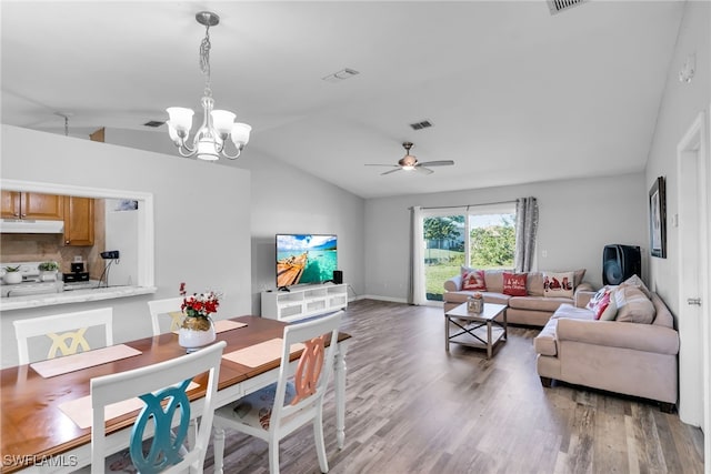 living room with dark hardwood / wood-style flooring, ceiling fan with notable chandelier, and lofted ceiling