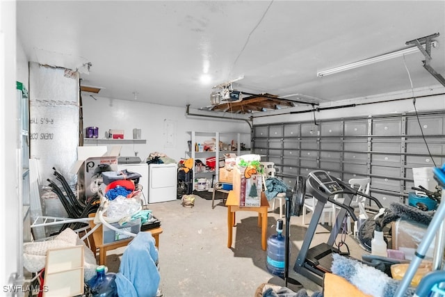 garage featuring a garage door opener and washer and clothes dryer