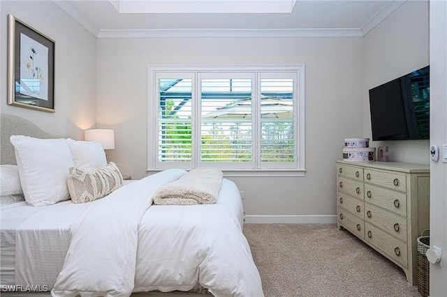 carpeted bedroom featuring crown molding