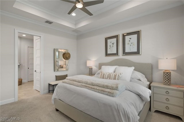 bedroom featuring ceiling fan, light colored carpet, ornamental molding, and a raised ceiling