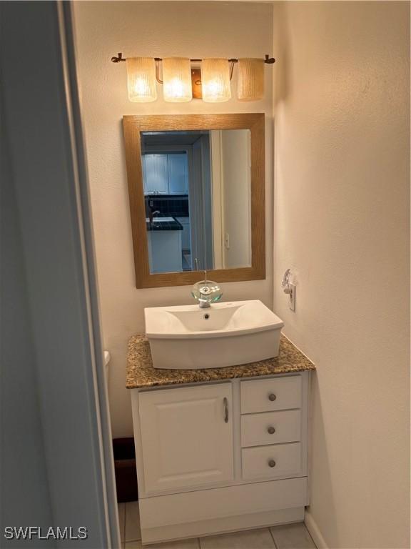 bathroom with vanity and tile patterned floors