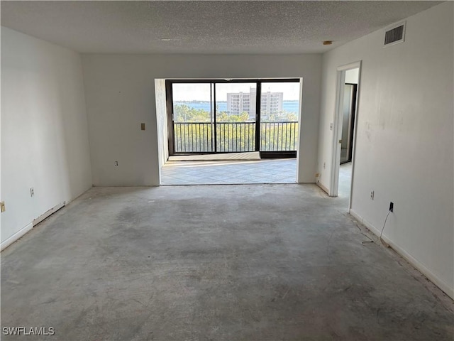 empty room featuring a textured ceiling