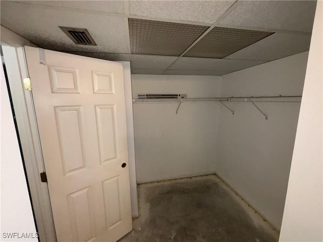 spacious closet featuring a drop ceiling