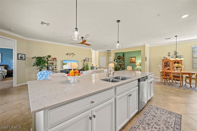 kitchen with sink, white cabinetry, ornamental molding, a center island with sink, and stainless steel dishwasher