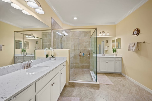 bathroom featuring a shower with door, crown molding, vanity, and tile patterned floors