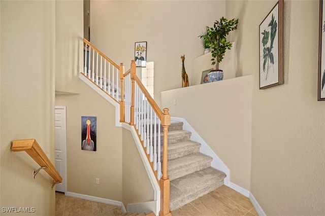 staircase with tile patterned flooring