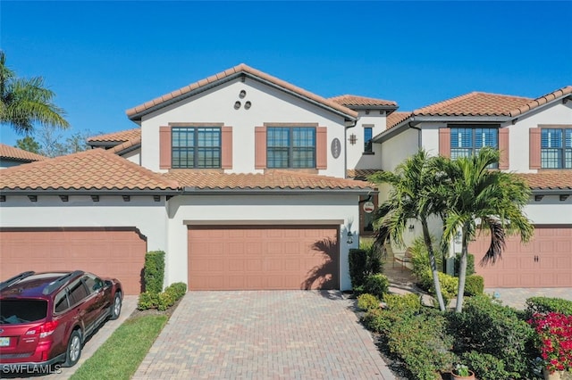 mediterranean / spanish-style house featuring a garage