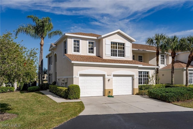 view of front of property with a garage and a front lawn