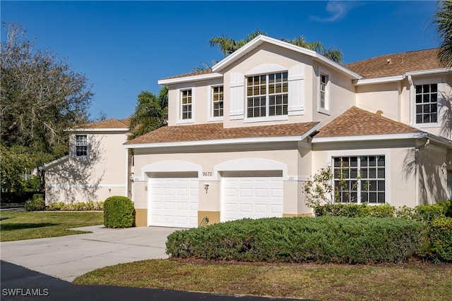 view of front of home featuring a garage and a front lawn