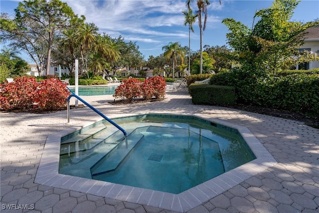 view of pool featuring a community hot tub