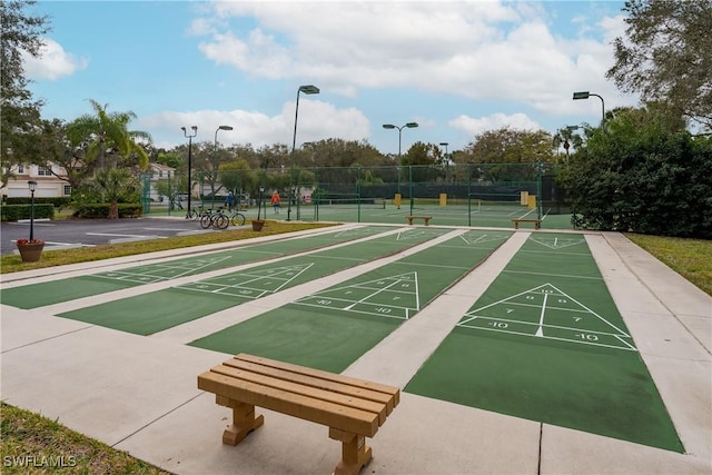 surrounding community with tennis court