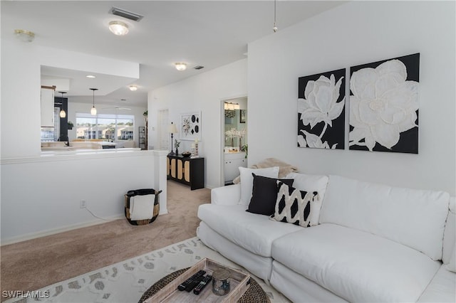 living room with light colored carpet