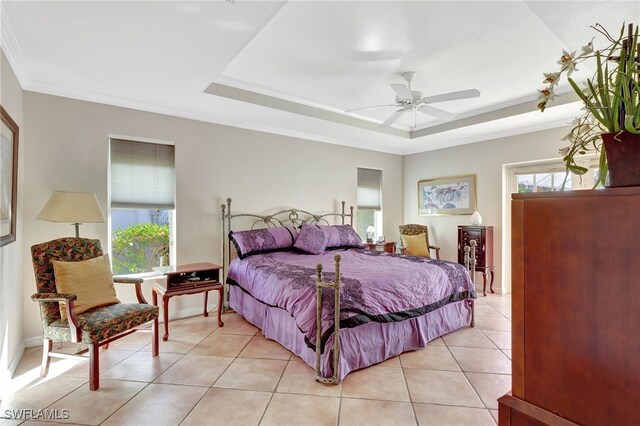 bedroom with multiple windows, light tile patterned floors, ornamental molding, and a raised ceiling