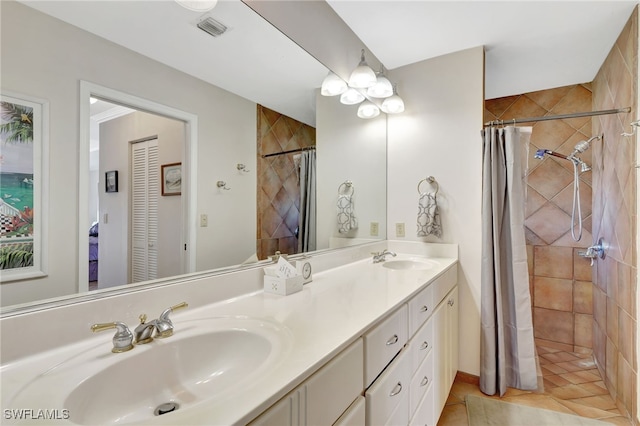 bathroom featuring vanity and a shower with shower curtain