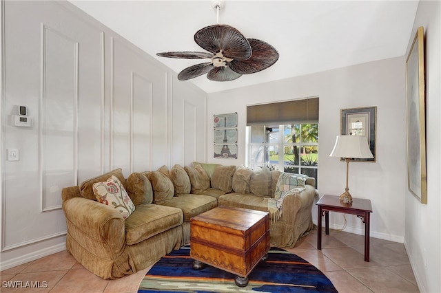 living room featuring light tile patterned floors and ceiling fan