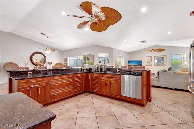 kitchen featuring dishwasher, dark stone counters, ceiling fan, and decorative light fixtures