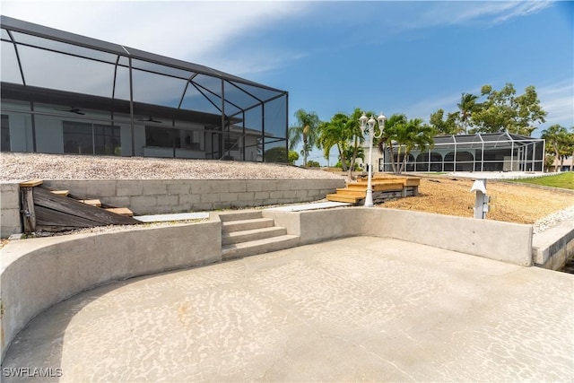 view of patio with glass enclosure