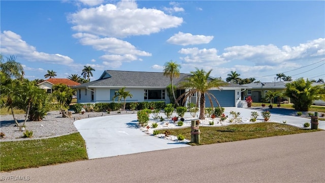 ranch-style home featuring a garage and a front lawn