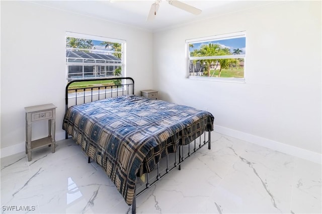 bedroom featuring ornamental molding and ceiling fan