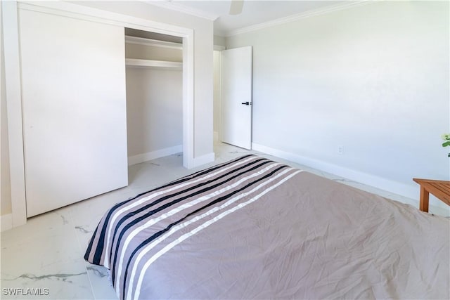 unfurnished bedroom featuring crown molding, ceiling fan, and a closet