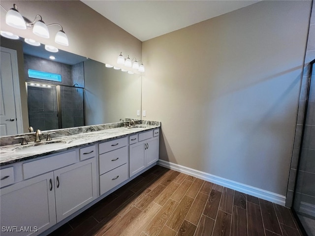 bathroom featuring vanity and an enclosed shower