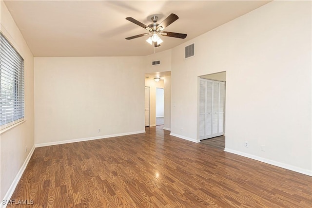 spare room with ceiling fan and dark hardwood / wood-style floors